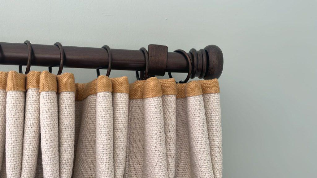 Photo of bronze button finial curtain pole