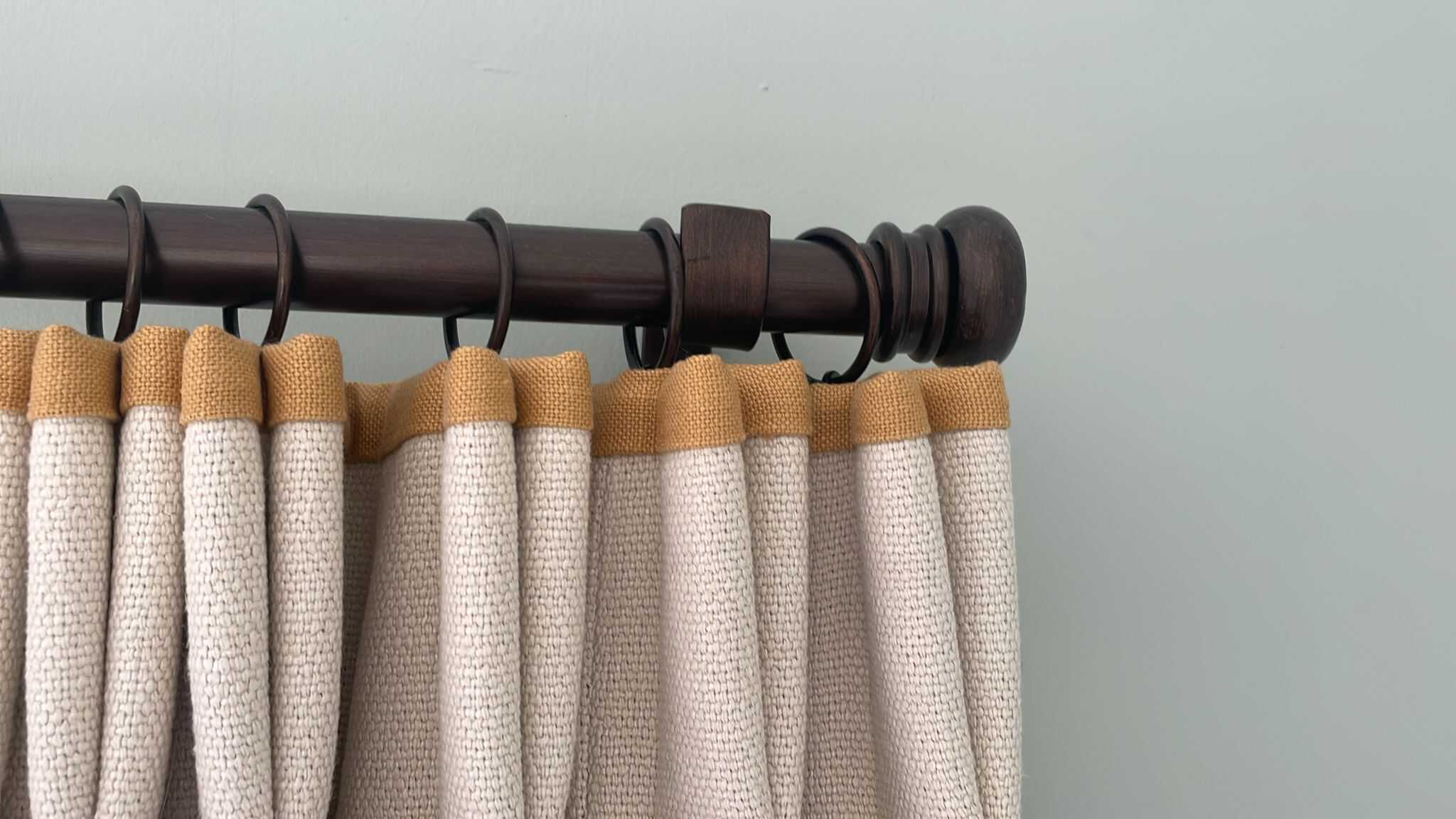 0653162B-7EB4-4116-8068-C54A00D8D17C Photo of bronze button finial curtain pole